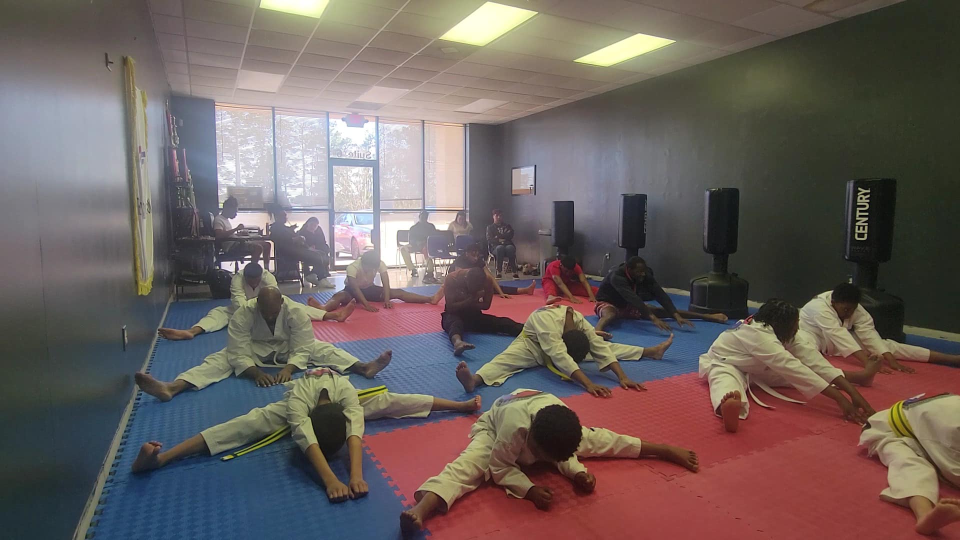 Riverdale Taekwondo students stretching before class